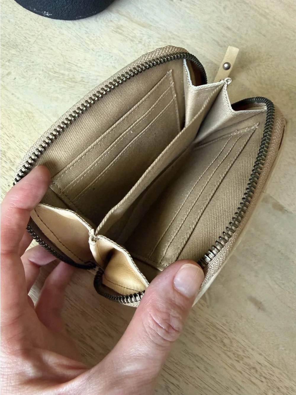 Fossil brand light Beige Patchwork Leather zip around Wallet with Button detail